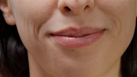 Macro Shot Of Female Model Smiling And Moving Lips On Camera Stock