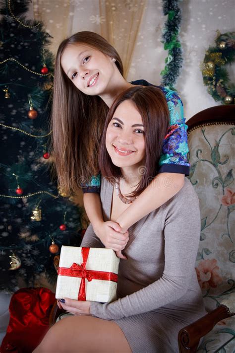 Daughter And Mother Under Christmas Tree Stock Image Image Of