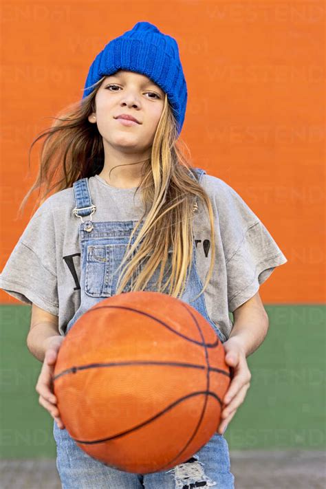 Young Girl Playing Basketball Stock Photo