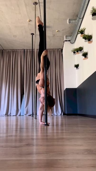 Flexible Woman Does Acrobatic Tricks Around Pole Jukin Licensing
