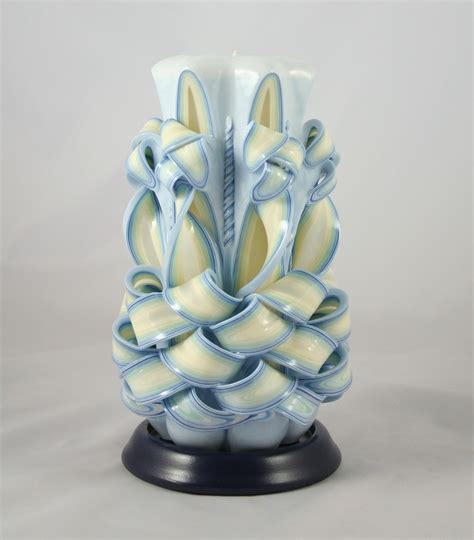 Intricate Candle Carving Forms Blooming Designs With Layered Wax
