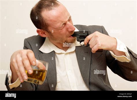 Sad Man Shoots In His Mouth Holding A Whiskey Glas Stock