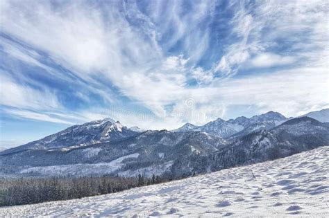 Beautiful Panorama Of Snow Covered Valley With Mountains In The Stock