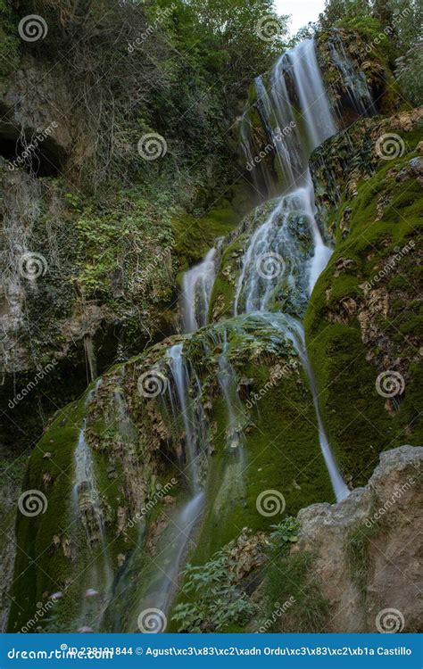 Turquoise Water Waterfall In Orbaneja Del Castillo Stock Photo Image