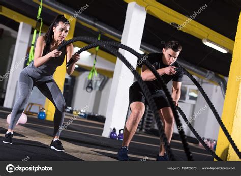 Young Fit Sports Couple Working Out Functional Training Gym Doing Stock