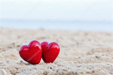 Two Red Hearts On The Beach Symbolizing Love Valentines Day Romantic