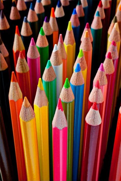 Many Different Colored Pencils Are Lined Up Together