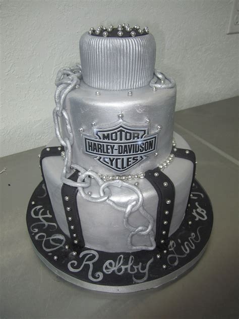 A Motorcycle Themed Birthday Cake With Chains On The Bottom And Harley