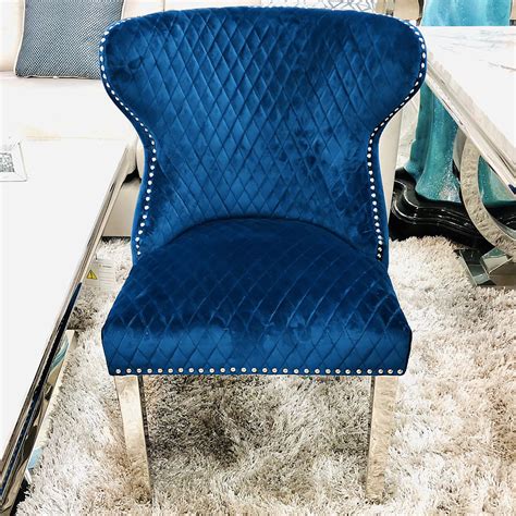 Shop online for chairs and benches in modern upholstery such as velvet, leather and rattan. Diana Wide Blue Velvet And Chrome Dining Chair With Lion ...