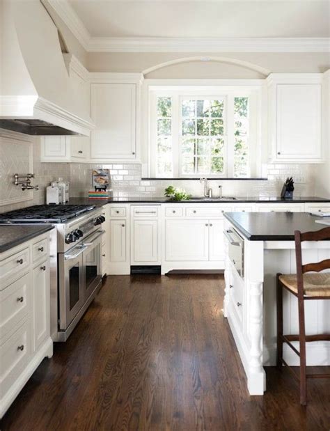 White kitchen dark wood floors. Dark Floors, White Walls - Pinterest Addict