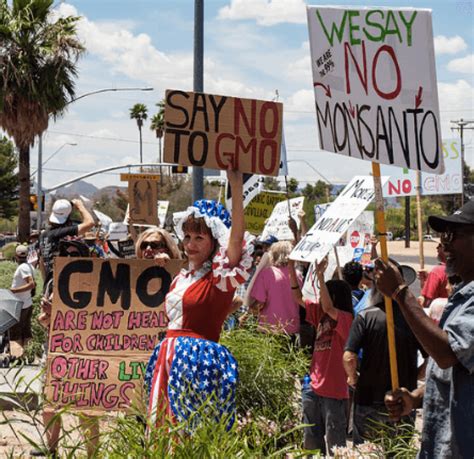 protestors arrested after throwing cash into senate chamber during gmo labeling vote genetic