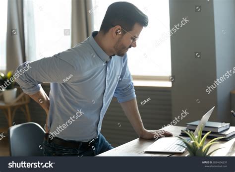 Businessman Touches Lower Back Feeling Pain Stock Photo 1854696331
