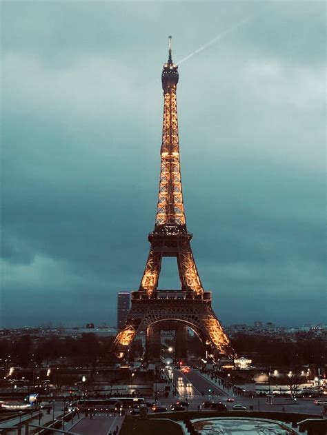 Eiffel Tower In Paris France Under Cloudy Sky · Free Stock Photo