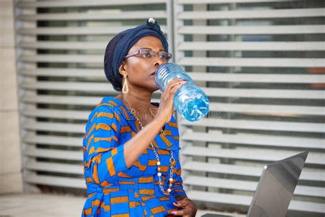 Beautiful Adult Business Woman Drinking Mineral Water Stock Image