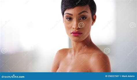 close up of gorgeous nude black female in her 20s staring at camera indoors stock video video