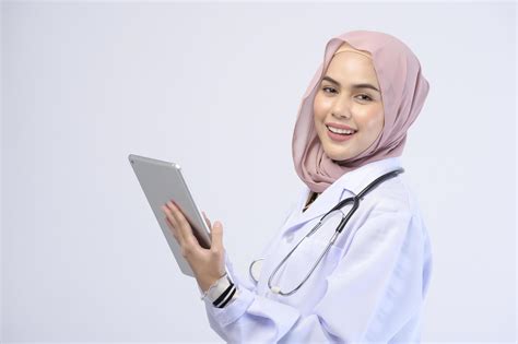 Female Muslim Doctor With Hijab Over White Background Studio 5557880