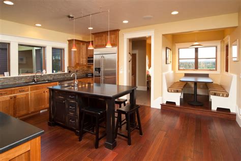 Brazilian walnut colored or cherry rich hardwood floors when paired with a light grain hardwood such as maple or hickory lighten the atmosphere, create and light and bright interiors and add more drama to the room. 34 Kitchens with Dark Wood Floors (Pictures)