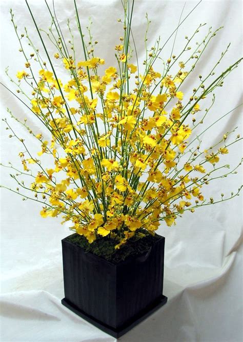 This Is A Cube Vase Floral Arrangement That Features Yellow Oncidium Orchids See Our Entire