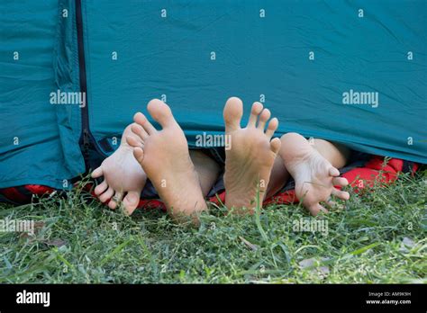 Two People S Feet Sticking Out Of Tent Door Stock Photo Royalty Free