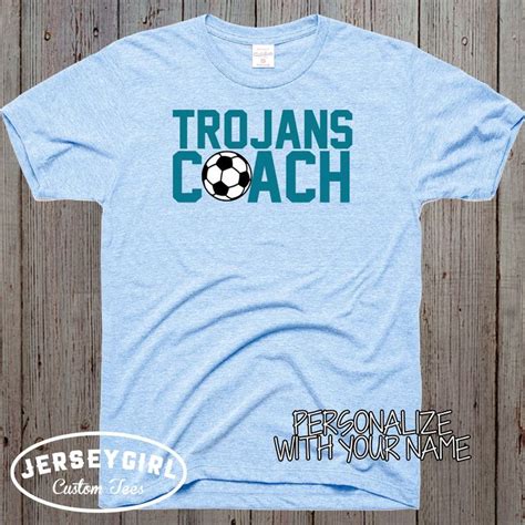 A Light Blue Shirt With The Wordstrojans Coach Personalize With Your
