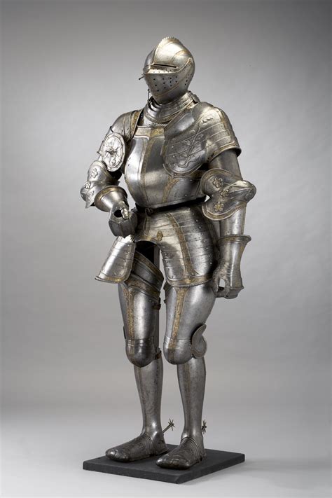 A Metal Statue Of A Man In Armor