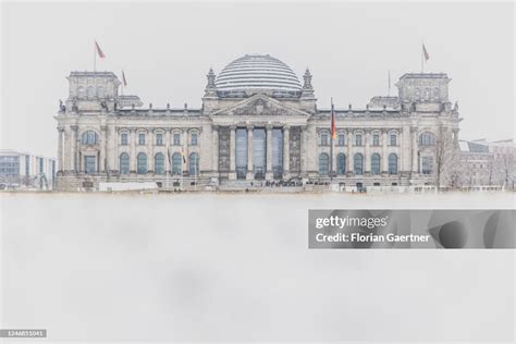 The Reichstag Building Is Pictured After Snowfall On February 06