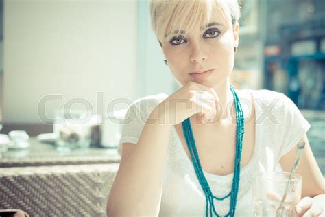 Beautiful Young Blonde Short Hair Hipster Woman At The Cafe Stock