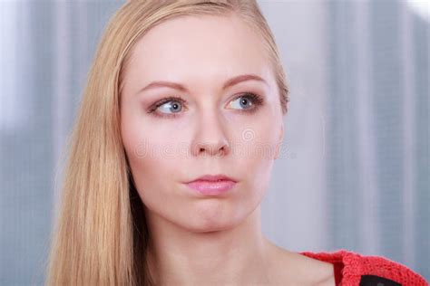 Portrait Of Blonde Woman With Serious Face Expression Stock Image
