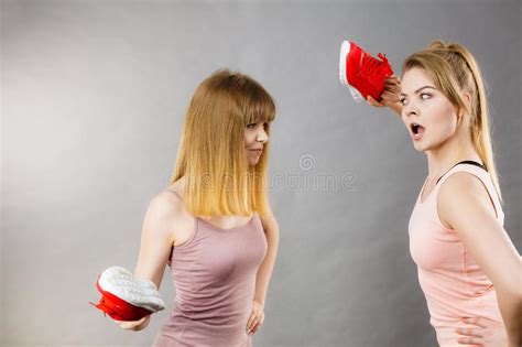 Two Agressive Women Fighting Using Shoes Stock Photo Image Of