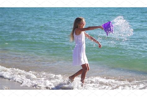 Cute Little Girl At Beach During People Images ~ Creative Market