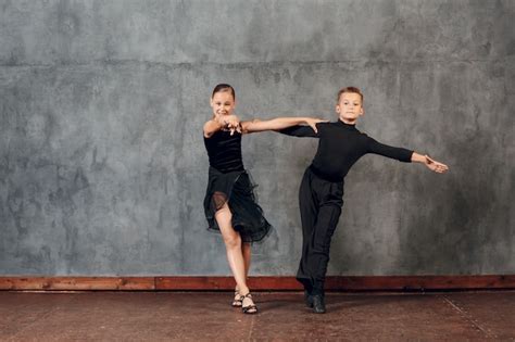 Premium Photo Young Couple Boy And Girl Dancing In Ballroom Dance Jive
