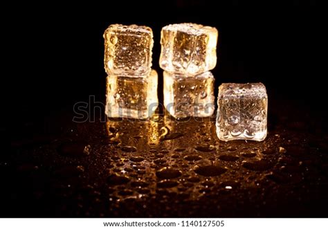 Golden Ice Cubes On Black Background Stock Photo 1140127505 Shutterstock