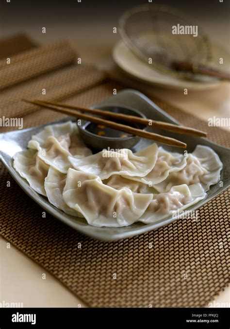 Zhong Shui Jiao Crescent Dumplings Served On Plate With Soy Dipping