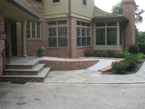 Flagstone And Brick Steps And Heated Handicap Ramp House Entrance