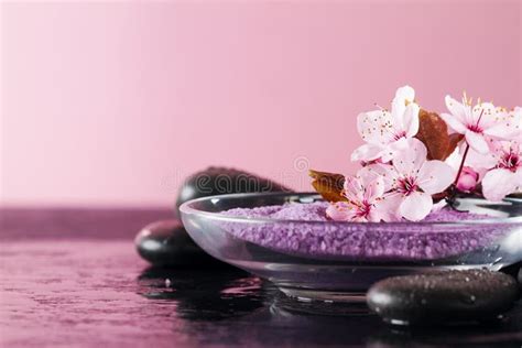 Beautiful Pink Spa Flowers On Spa Hot Stones On Water Wet Background