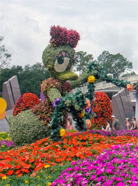 Spring Means Flowers With Disney Character At Walt Disney Worlds Epcot