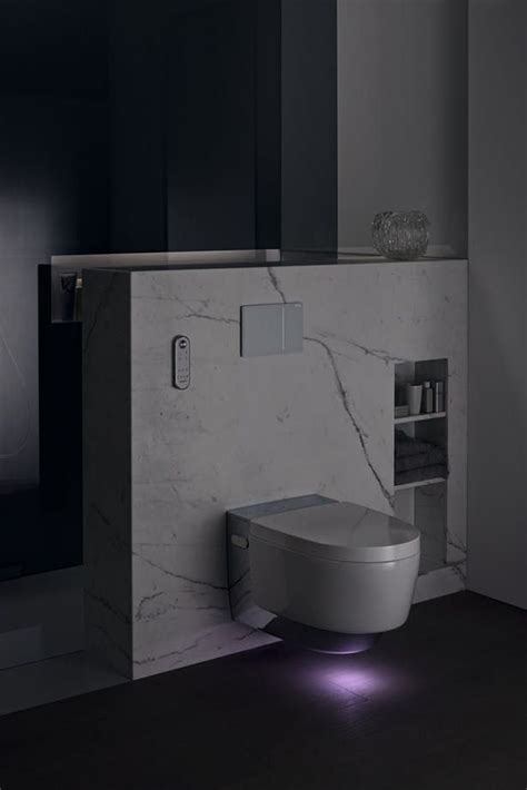 Futuristic Toilet With Light In It Together With The Marble Wall It