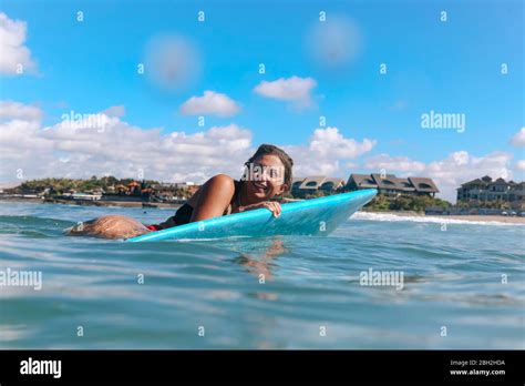 Female Surfer Lying On Surf Board Bali Indonesia Stock Photo Alamy