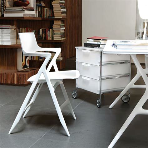 This folding chair dolly has two tiers for effective storage, saving space. Kartell Dolly Folding Chair : surrounding.com