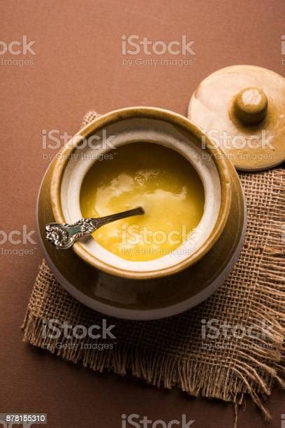 Desi Pure Ghee Or Clarified Butter In Glass Or Copper Container With
