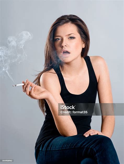 Beautiful Girl Smoking A Cigarette Stock Photo Download Image Now