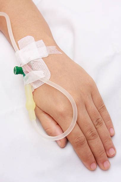Iv Drip Injecting Human Arm Human Hand Stock Photos Pictures And Royalty