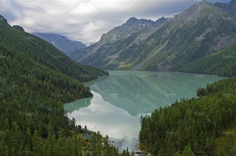 Reflection Of Mountains In The Lake Containing Lake Kucherla And