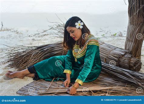 Beautiful Maldivian Girl In National Dress Making Roof Sheets Editorial