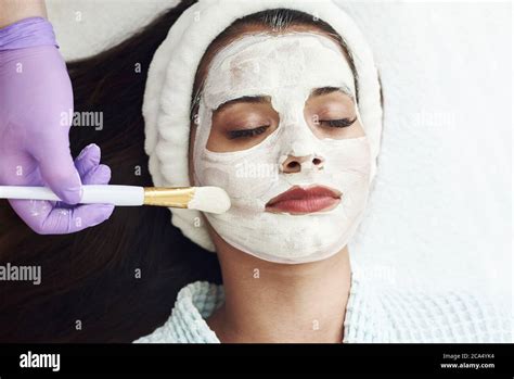 Spa Concept Young Woman With Nutrient Facial Mask In Beauty Salon