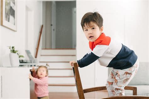 Kid Climbing On Furniture By Stocksy Contributor Lauren Lee Stocksy