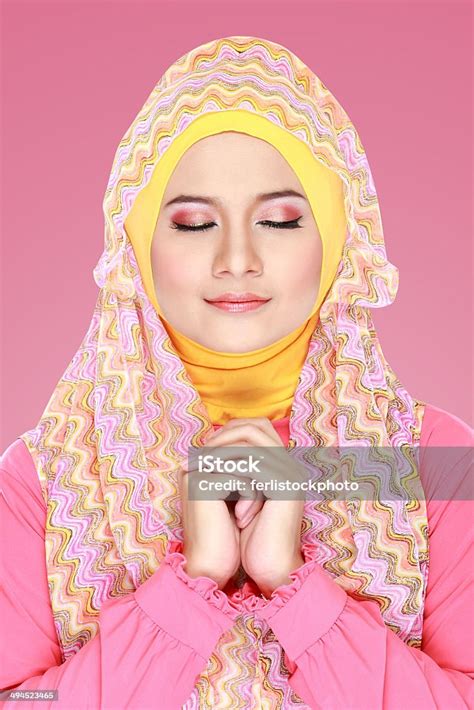 Young Beautiful Muslim Woman With Pink Costume Wearing Hijab Stock