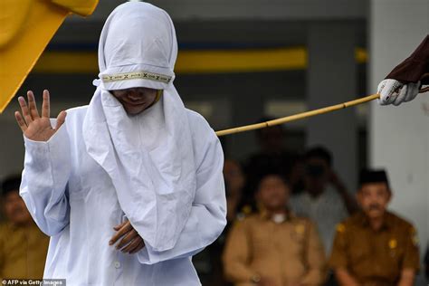 Photos Of Indonesian Woman Flogged Mercilessly In Public For Having Sex Outside Marriage