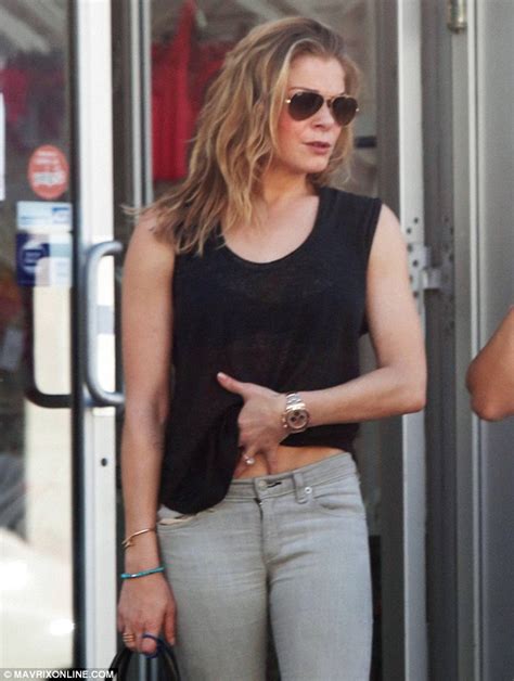 leann rimes lifts her top to reveal toned stomach during shopping outing daily mail online
