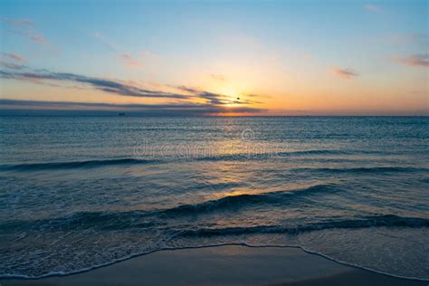 Peaceful Beautiful Sunset With Sea Water On The Summer Beach Stock